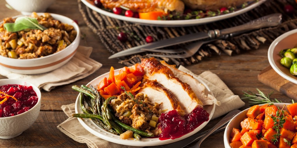 Thanksgiving Turkey day spread on harvest table.