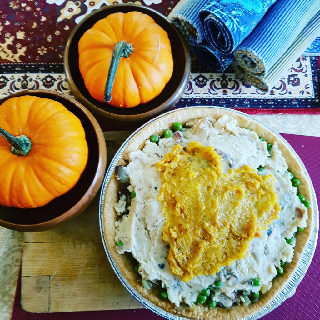 Memories of Thanksgiving Pie - A Recipe for leftovers. Table top view of two pumpkins and the Memories of Thanksgiving Pie