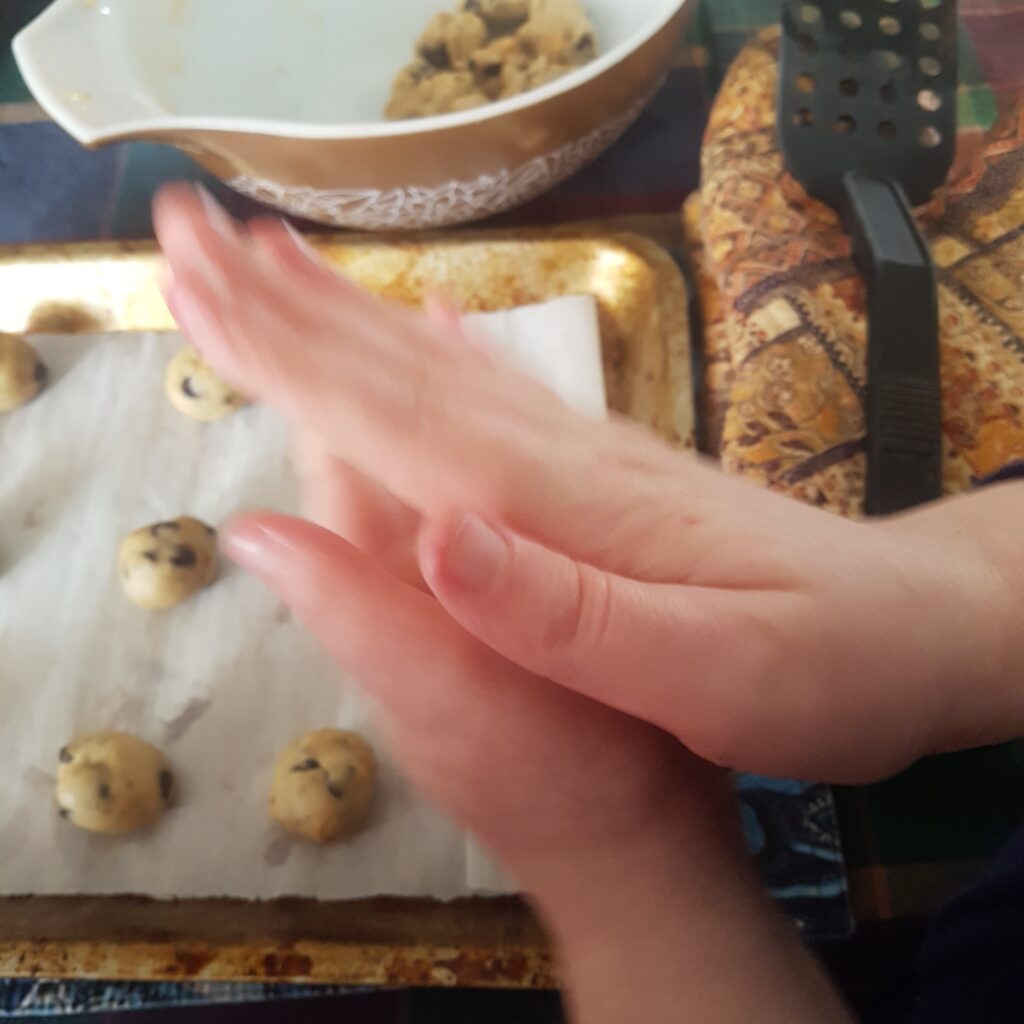 Chocolate Chip & Chia Seed Two-Bite Cookies - Rolling cookie dough into balls and lining them up on a baking tray